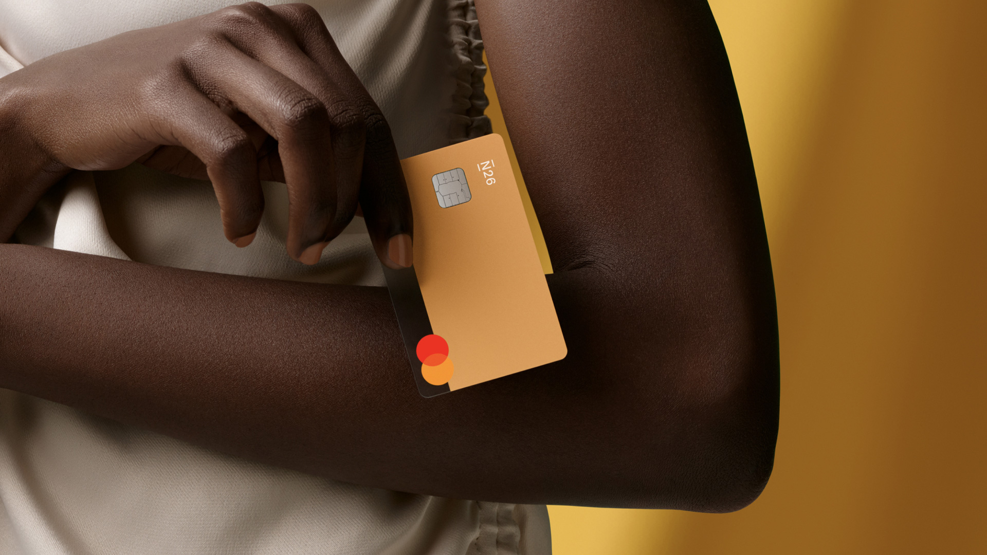 Woman holding N26 You Bank Card